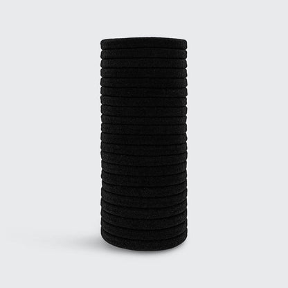 KITSCH Black Elastic Hair Ties 20pc Set — product lifestyle shot showing pack of 20 in black — consciously created from recycled materials — glide gently through hair for a tight all-day hold