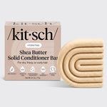 KITSCH Shea Butter Hydrating Solid Conditioner Bar — hero product shot on light gray background — HYDRATING Shea Butter Solid Conditioner Bar retail box with bar — For dry, frizzy, or curly hair — Bio-based | Made in USA | Sustainably Sourced | 100 Washes | Cruelty-Free — Net Wt. 2.7 oz / 77g — Richly hydrates dry, thirsty strands — Seals in essential moisture to help tame unwanted frizz