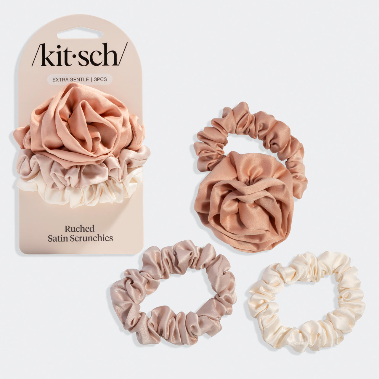 Set of Terracotta satin scrunchies with packaging labeled 'kit-sch' on a grey background