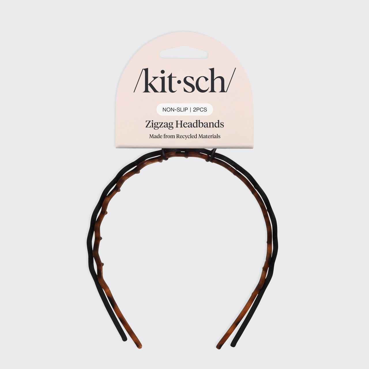 Detail close-up of Kitsch Zig Zag Headbands showing the classic black and tortoiseshell finish