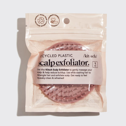 Model using Terracotta Scalp Exfoliator on scalp while shampooing showing circular massage motion