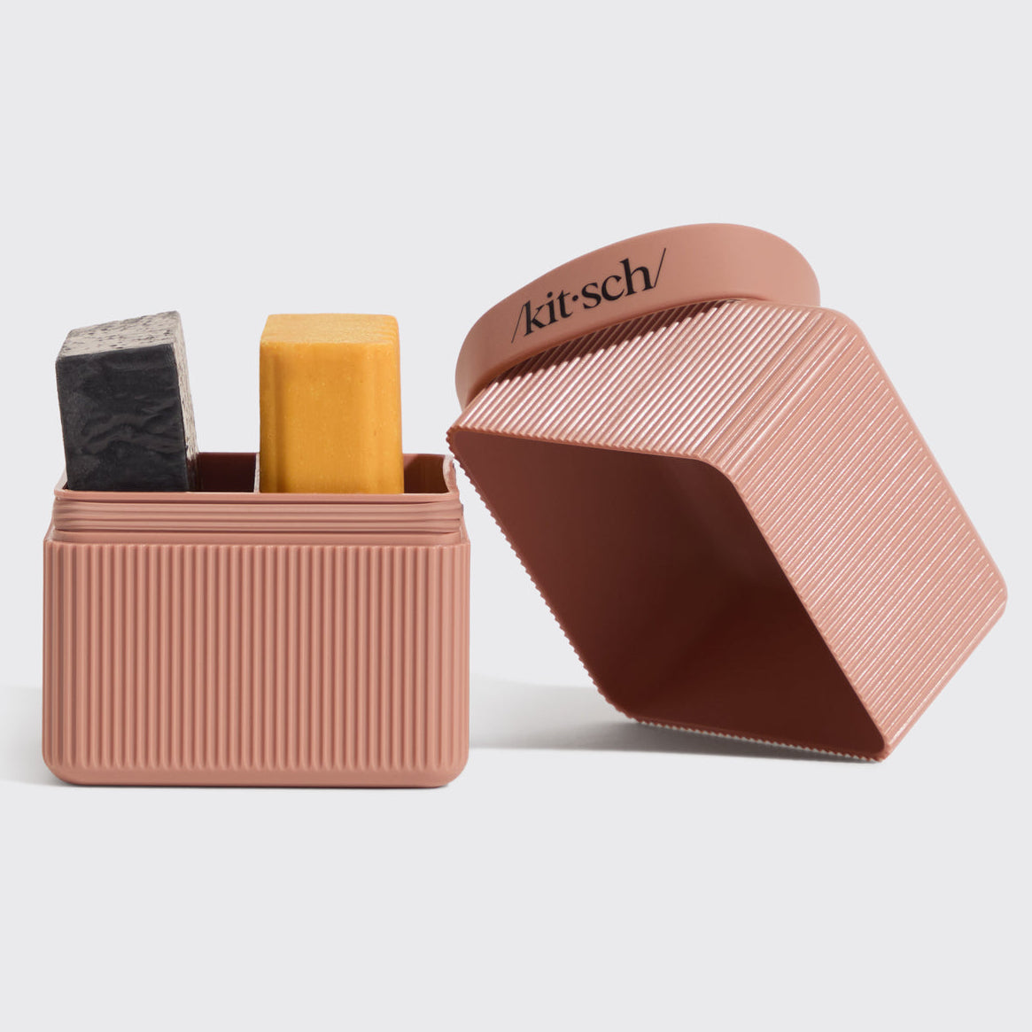 KITSCH 2-Compartment Travel Case Terracotta — hero open product shot showing lid propped up and dual compartments with bar soaps inside — ribbed terracotta case with Kitsch branding — Stylish & practical | Two spacious compartments — TSA-approved size — Eco-friendly; made from 100% recycled plastic
