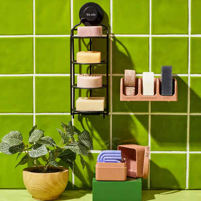 Kitsch Self-Draining Shower Caddy styled in a clean modern bathroom with bar soaps and accessories