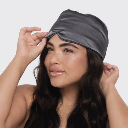 KITSCH Charcoal Satin Eye Mask — lifestyle shot — worn during sleep for light blockage and skin comfort