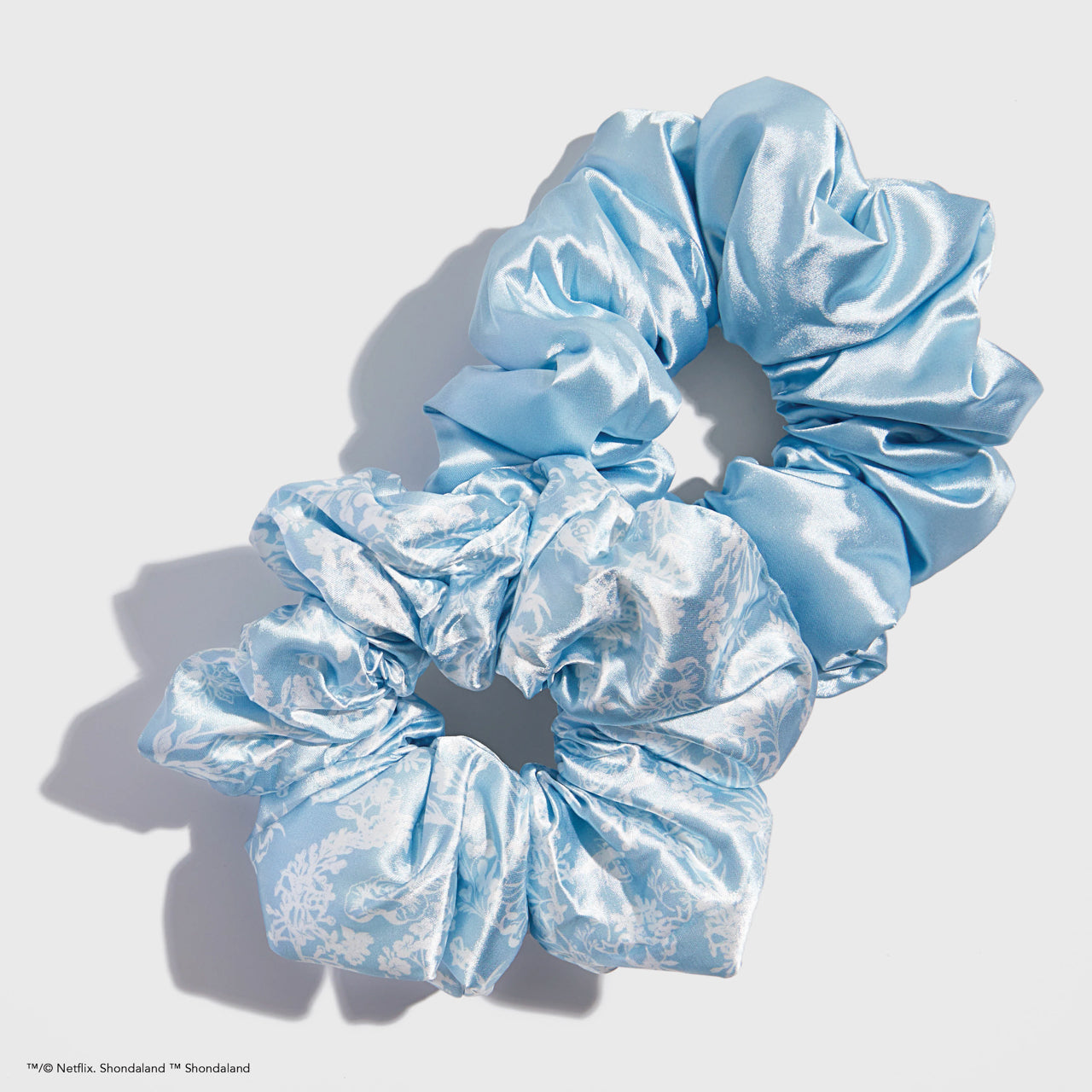 KITSCH Kitsch x Bridgerton Satin Pillow Scrunchies in Toile De Blue — product flat lay — Bridgerton x KITSCH collab in elegant Toile satin — pillow-soft satin gentle enough to sleep in