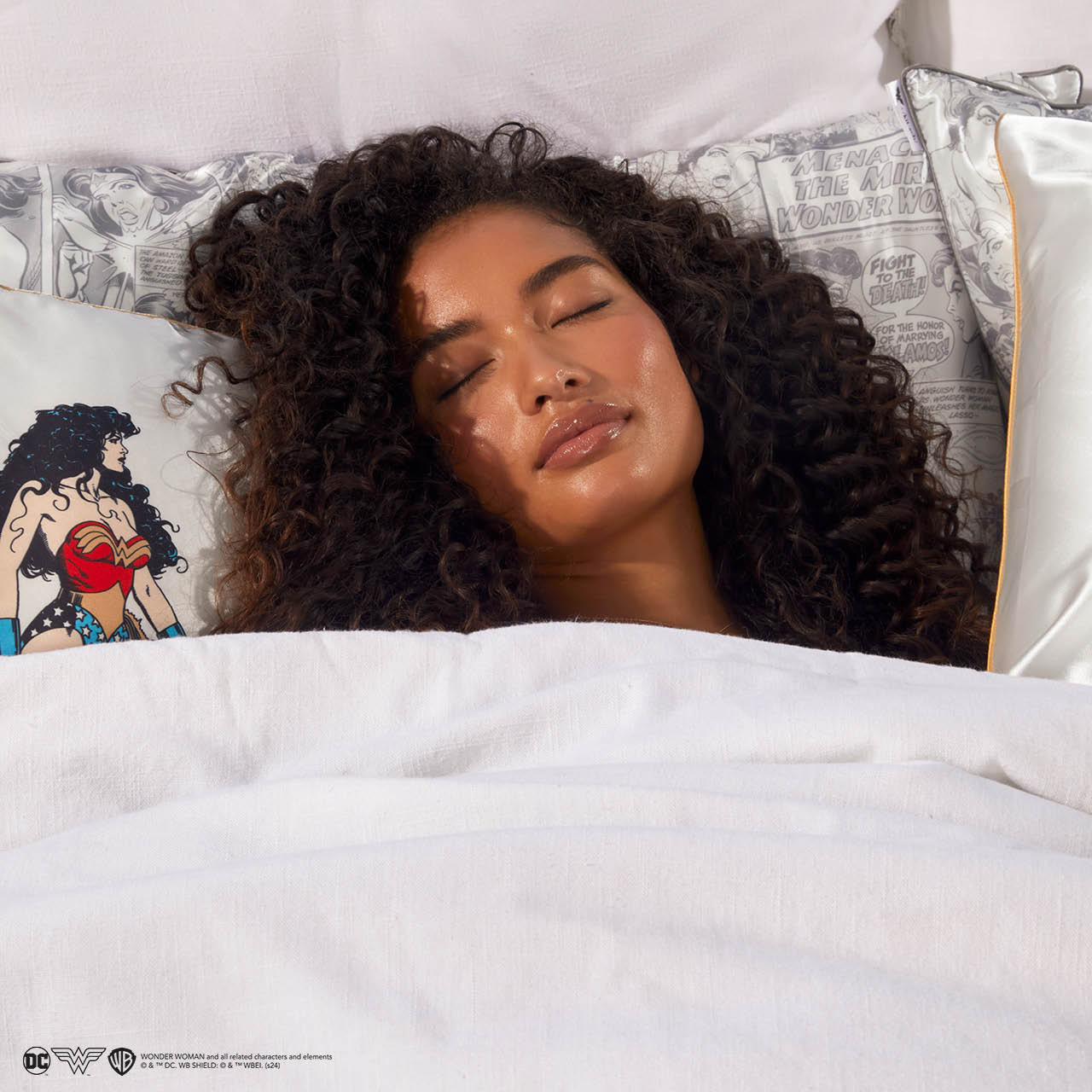 Model sleeping on Kitsch x Wonder Woman Comic Print Standard Satin Pillowcase