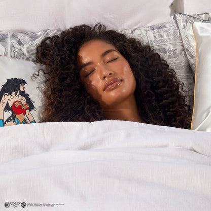 Model sleeping on Kitsch x Wonder Woman Comic Print Standard Satin Pillowcase