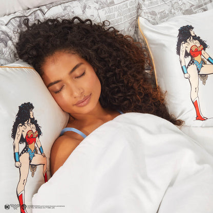 Model sleeping on Kitsch x Wonder Woman Believe in Wonder Standard Satin Pillowcase
