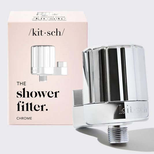 Chrome shower filter with 'kit·sch' branding and packaging on a light gray background