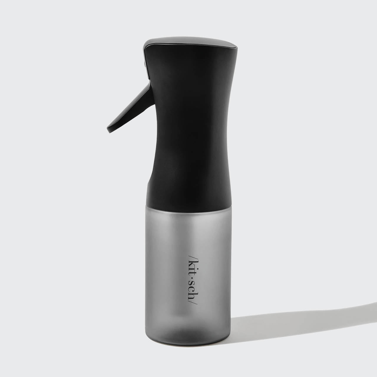 Close-up of Black Continuous Spray nozzle and trigger mechanism