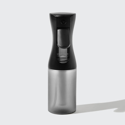 Model using Black Continuous Spray to mist hair showing fine mist output
