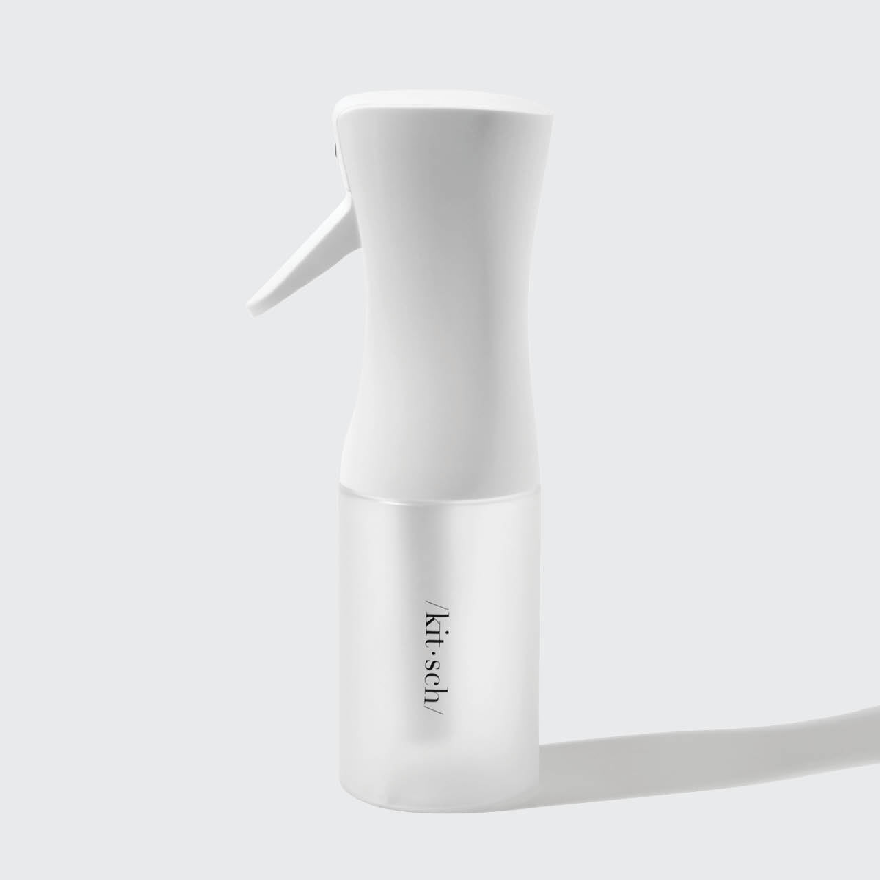 Close-up of White Continuous Spray nozzle and trigger mechanism
