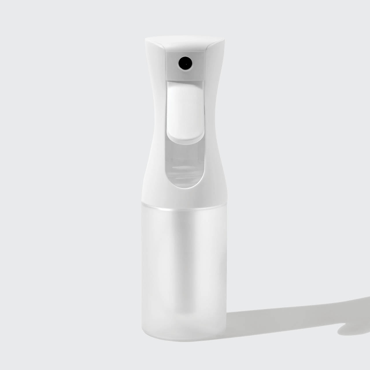 Model using White Continuous Spray to mist hair showing fine mist output