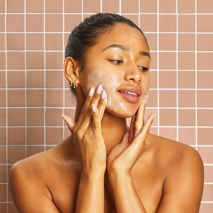 KITSCH Kojic Acid Bar for Hyperpigmentation & Dark Spots — model with bar and packaging — Formulated to help your skin glow from within by fading the look of dark spots and hyperpigmentation — made in the USA, Vegan, Cruelty Free, Leaping Bunny Certified