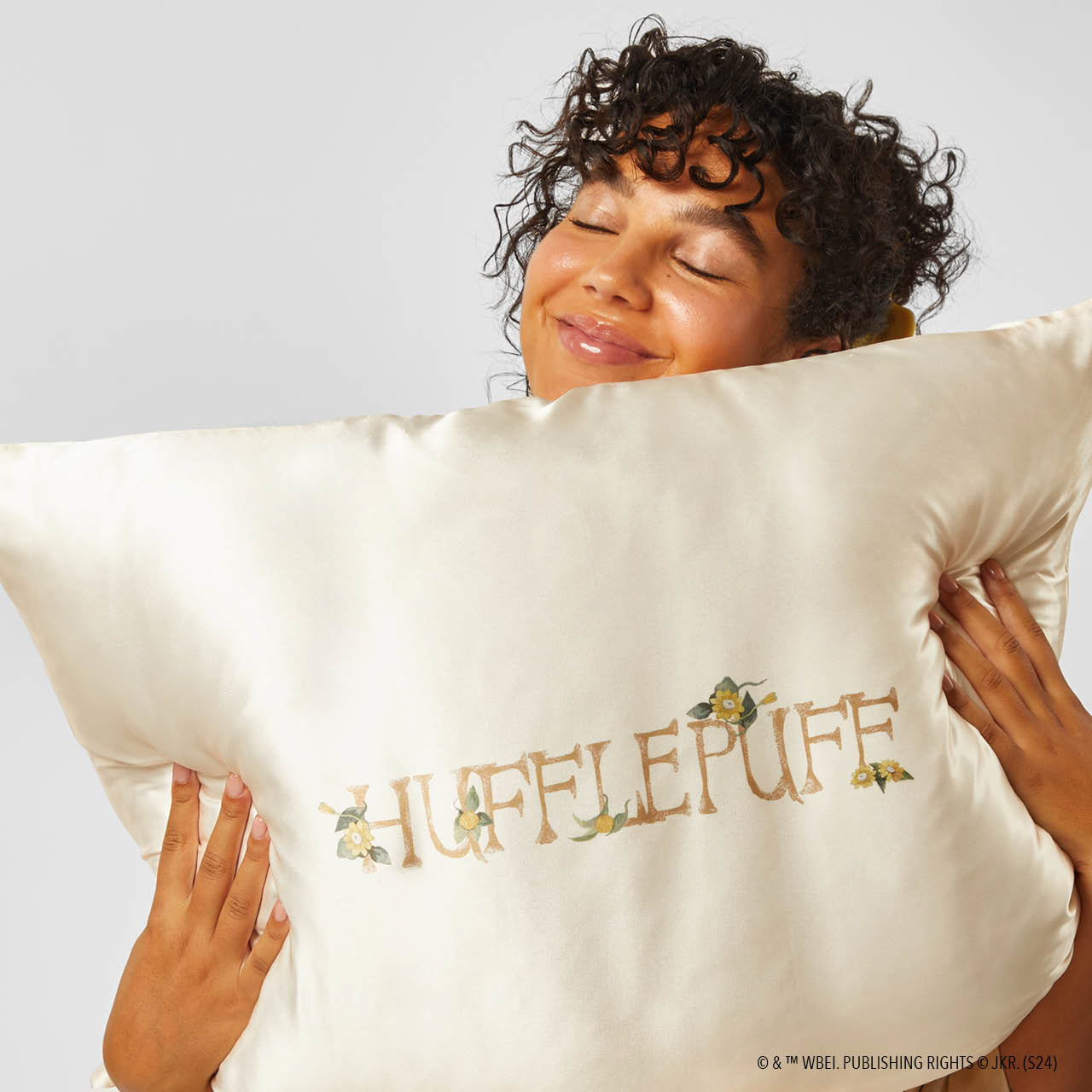 Model sleeping on Kitsch x Harry Potter Hufflepuff Standard Satin Pillowcase