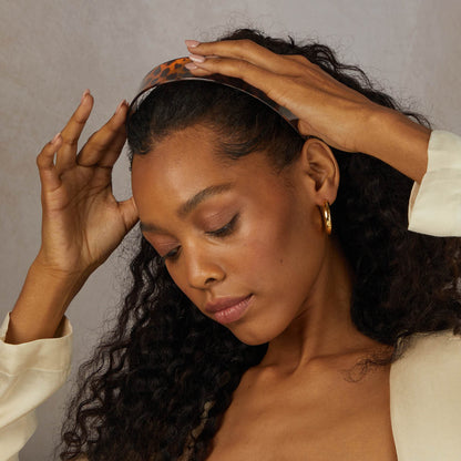 KITSCH Tort Wide Headband — lifestyle model shot with tort-print headband — perfect for tucking hair back with effortless style