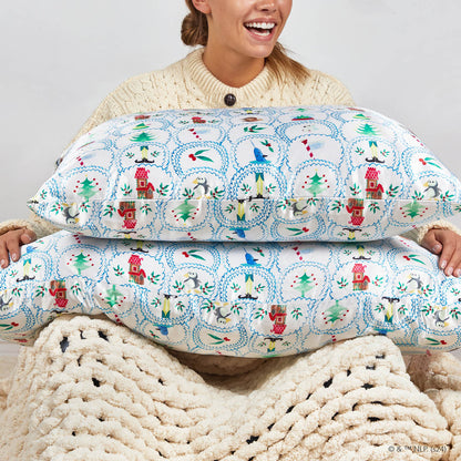 Model sleeping on Kitsch x Elf North Pole King Satin Pillowcase