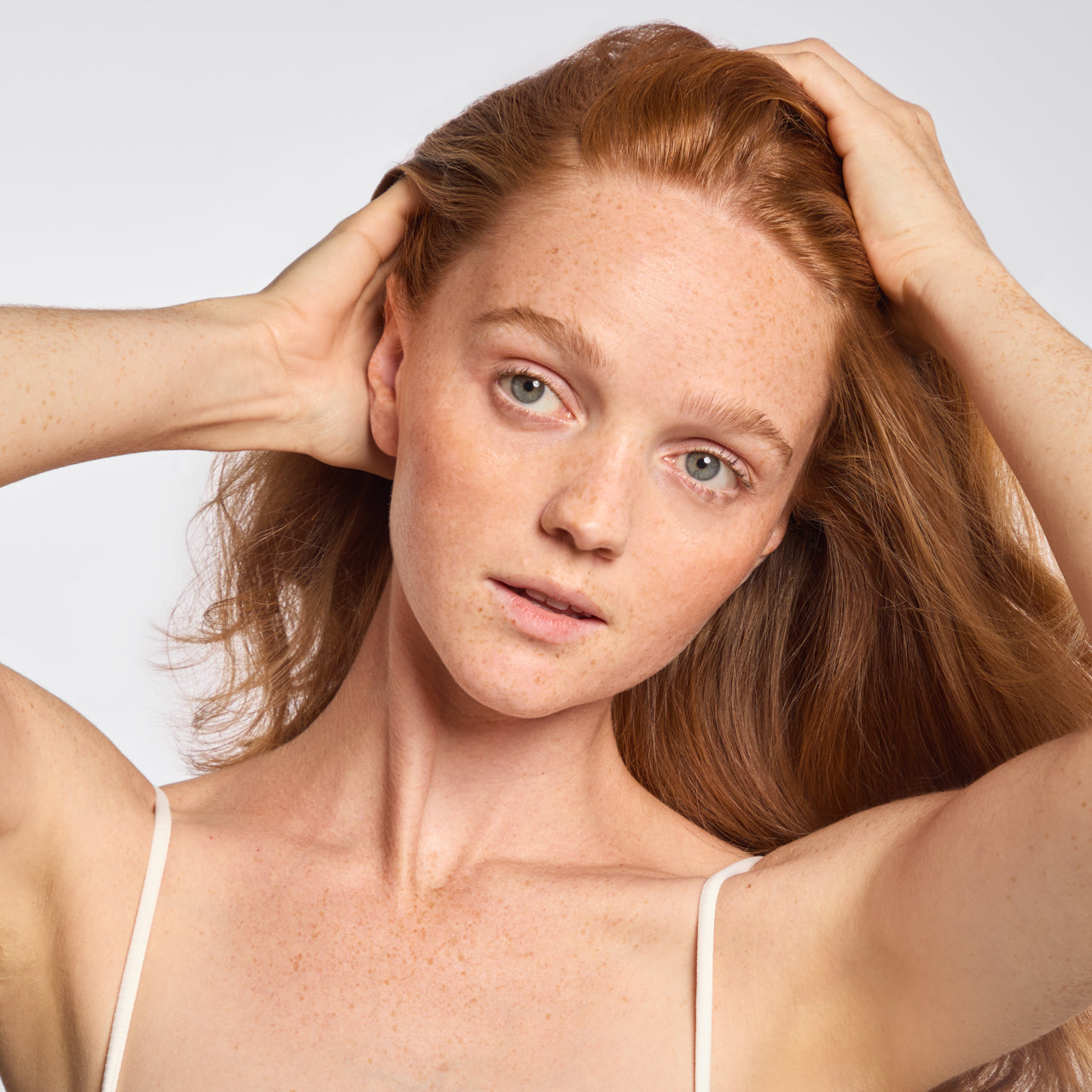 KITSCH Scalp & Hair Oil Applicator in terracotta — lifestyle shot with scalp oil bottles