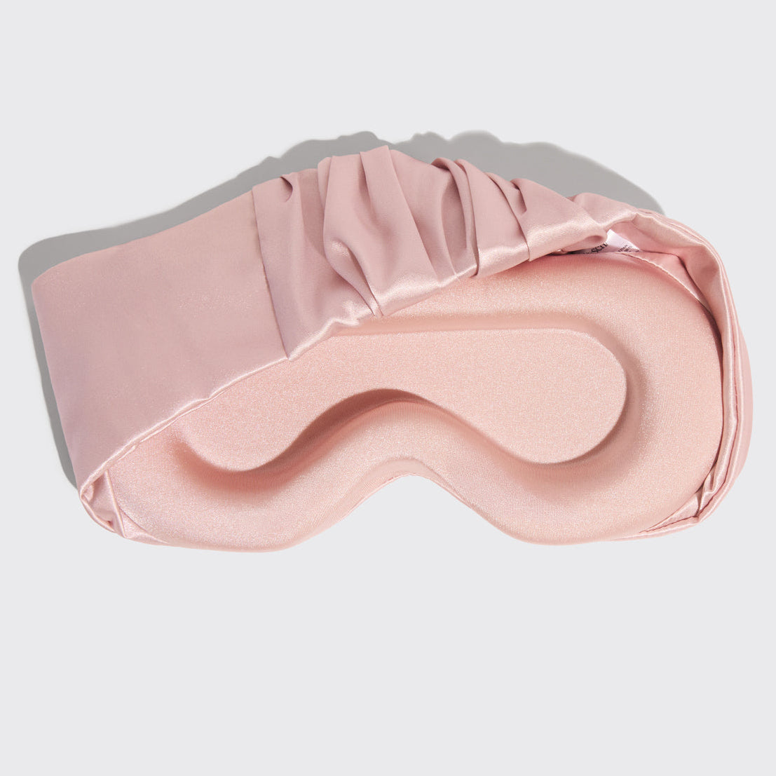 Model wearing Blush Contour Pillow Eye Mask showing relaxed fit over eyes