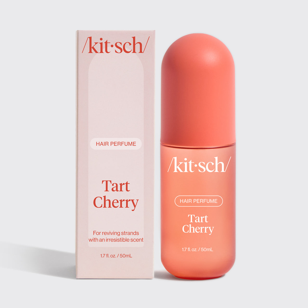 Kitsch Tart Cherry Hair & Body Perfume Mist bottle on a soft pink background