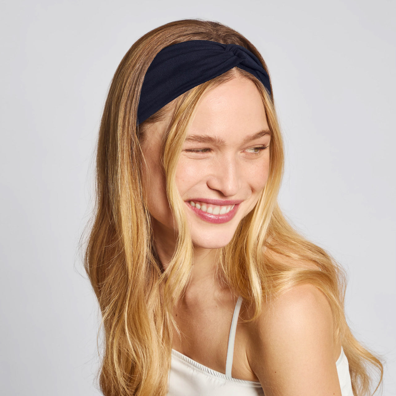 KITSCH Garden Bouquet Wide Twist Headbands 2pc Set — model wearing garden bouquet wide twist headband, hair kept neatly back — 2-piece set in coordinating floral hues