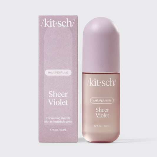 Kitsch Sheer Violet Hair & Body Perfume Mist bottle on a soft lilac background
