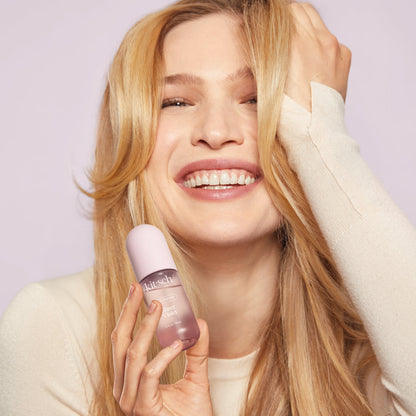 Close-up of Kitsch Sheer Violet Hair Perfume bottle showing the rose-gold spray cap