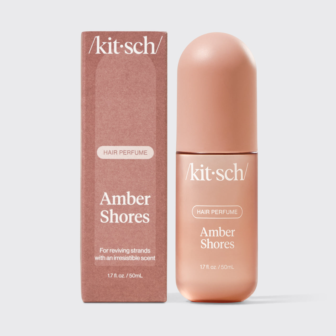 Kitsch Amber Shores Hair & Body Perfume Mist bottle on a soft warm background
