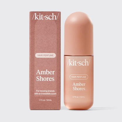 Kitsch Amber Shores Hair & Body Perfume Mist bottle on a soft warm background