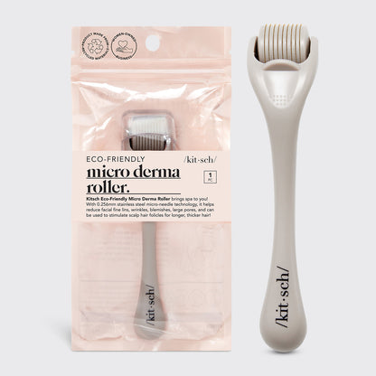 Kitsch Micro Derma Roller in Warm Gray lying flat showing fine needle wheel and handle