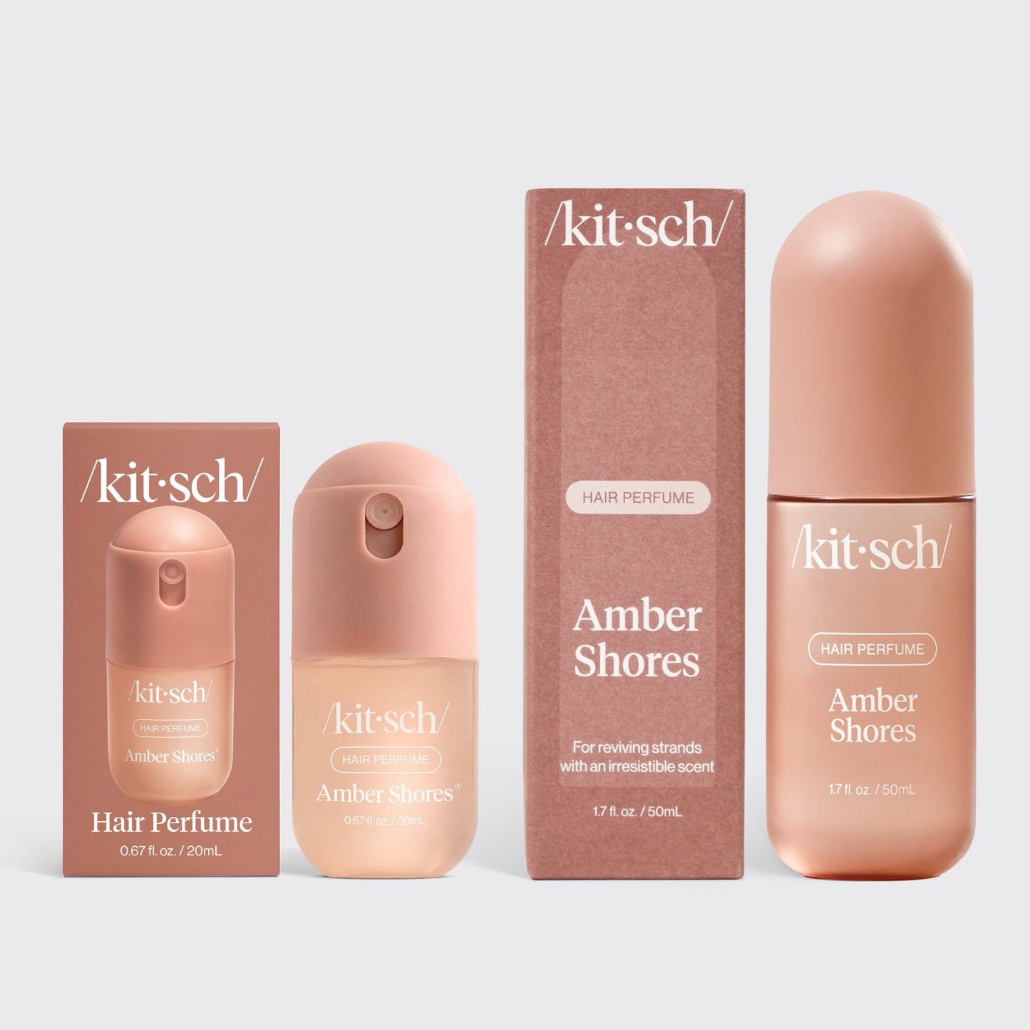 KITSCH Amber Shores Hair & Body Mist + Mini Set — product shot of the full-size 50mL and 20mL mini rose-gold spray bottles side by side — woody aquatic signature scent in two sizes for home and travel