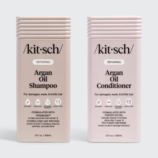 KITSCH Repairing Argan Oil Shampoo 12 fl. oz. & Conditioner 12 fl. oz. Combo — both labeled REPAIRING, For damaged, weak, & brittle hair — icons: Bio-Based, Nontoxic, Sustainably Sourced, Cruelty-Free — Shampoo formulated with Terabond™ & Hydrolyzed Oat Protein; Conditioner formulated with Fision® EcoSil & PhytoVie® Defense