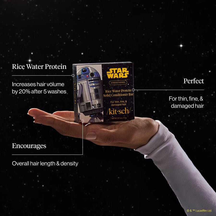 KITSCH x Star Wars™ Rice Water Protein Solid Conditioner Bar benefit infographic — hand holding R2-D2 edition box against dark galaxy backdrop — callouts: Rice Water Protein: Increases hair volume by 20% after 5 washes; Perfect For Thin, Fine, & Damaged Hair; Encourages Overall hair length & density