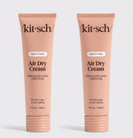Two tubes of Kitsch Smoothing Air Dry Cream formulated with castor oil, 5 fl. oz. (148 mL), displayed side by side on a white background for frizz-free, air-dry styling.