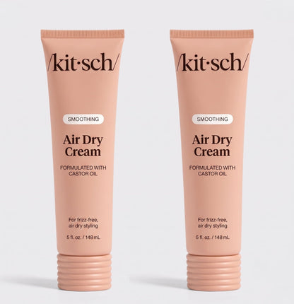 Two tubes of Kitsch Smoothing Air Dry Cream formulated with castor oil, 5 fl. oz. (148 mL), displayed side by side on a white background for frizz-free, air-dry styling.