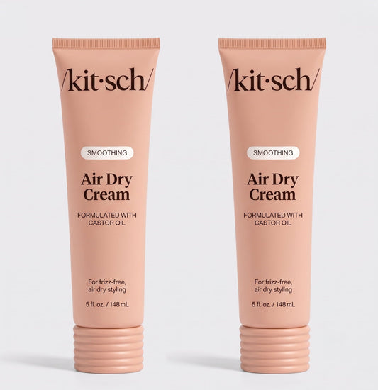 Two tubes of Kitsch Smoothing Air Dry Cream formulated with castor oil, 5 fl. oz. (148 mL), displayed side by side on a white background for frizz-free, air-dry styling.