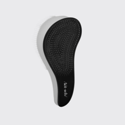Kitsch Black Detangling Brush angled view showing bristle base