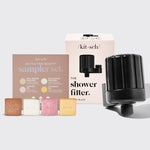 KITSCH Shower Filter + Shampoo & Conditioner 4pc Set Black — hero bundle flat lay — black shower filter attachment + 4pc shampoo & conditioner sampler bars — purify shower water for healthier hair & skin