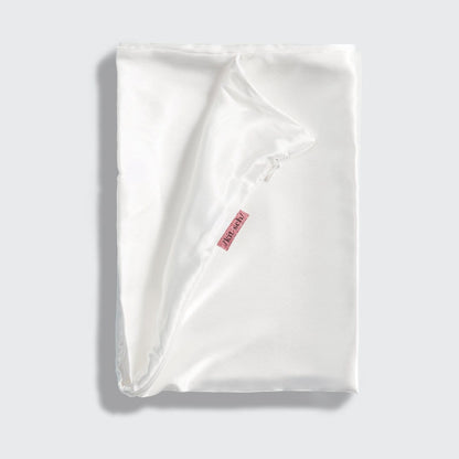 KITSCH Ivory Standard Satin Pillowcase — styled bedroom scene